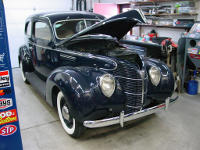 38 Ford Deluxe that underwent a firewall forward restoration, new wiring and a complete new interior, including the metal wood graining.