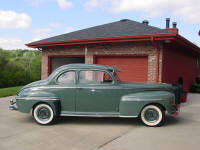46 Mercury whose motor is pictured to the left is ready for delivery.  The owner was all excited having last driven the car in 1959.