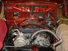 One of our competitors finest work. Maybe I'm being a bit harsh. After all they only charged the owner $17K to install a new engine and trans. Gotta love that upper radiator hose and the backwards air cleaner One of our competitors finest work. Maybe I'm being a bit harsh. After all they only charged the owner $17K to install a new engine and trans. Gotta love that upper radiator hose and the backwards air cleaner